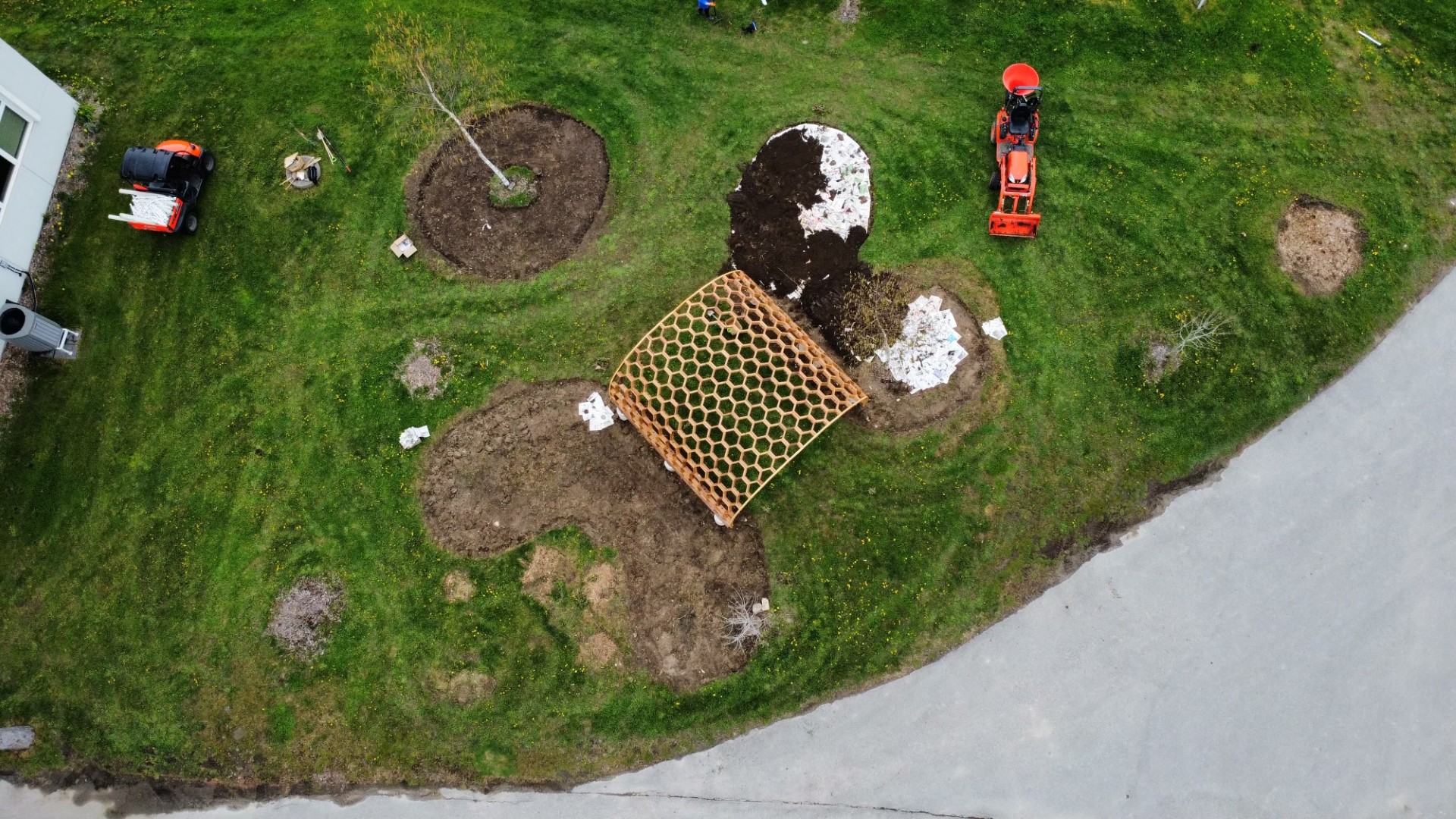 The construction of the Honeycomb Archway located outside the Office of Campus Infrastructure and Sustainability at the Campus Farm.