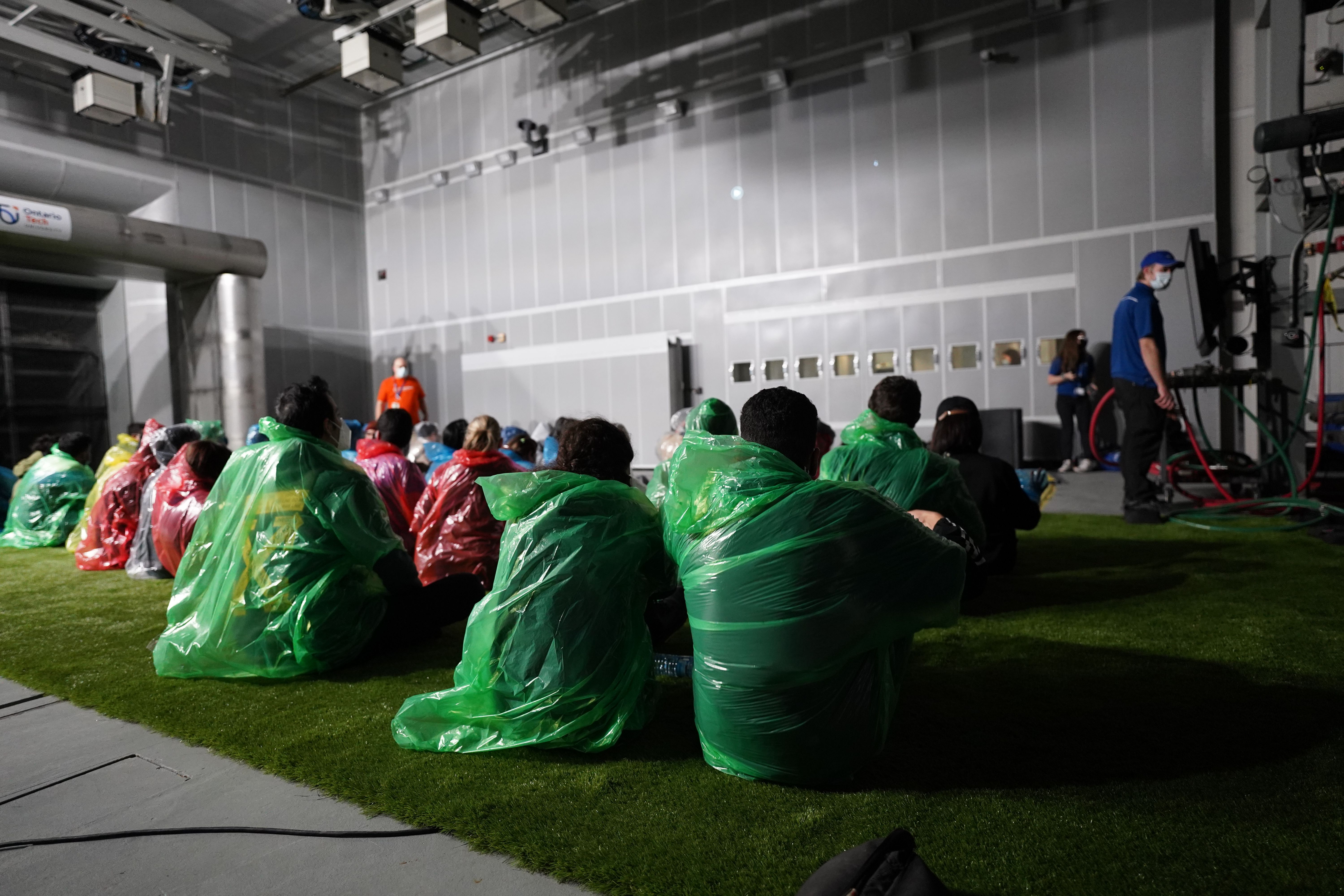 Students sitting in the climatic wind tunnel watching the Twister film.