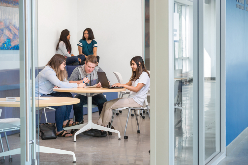 Students studying at a table at Ontario Tech University.