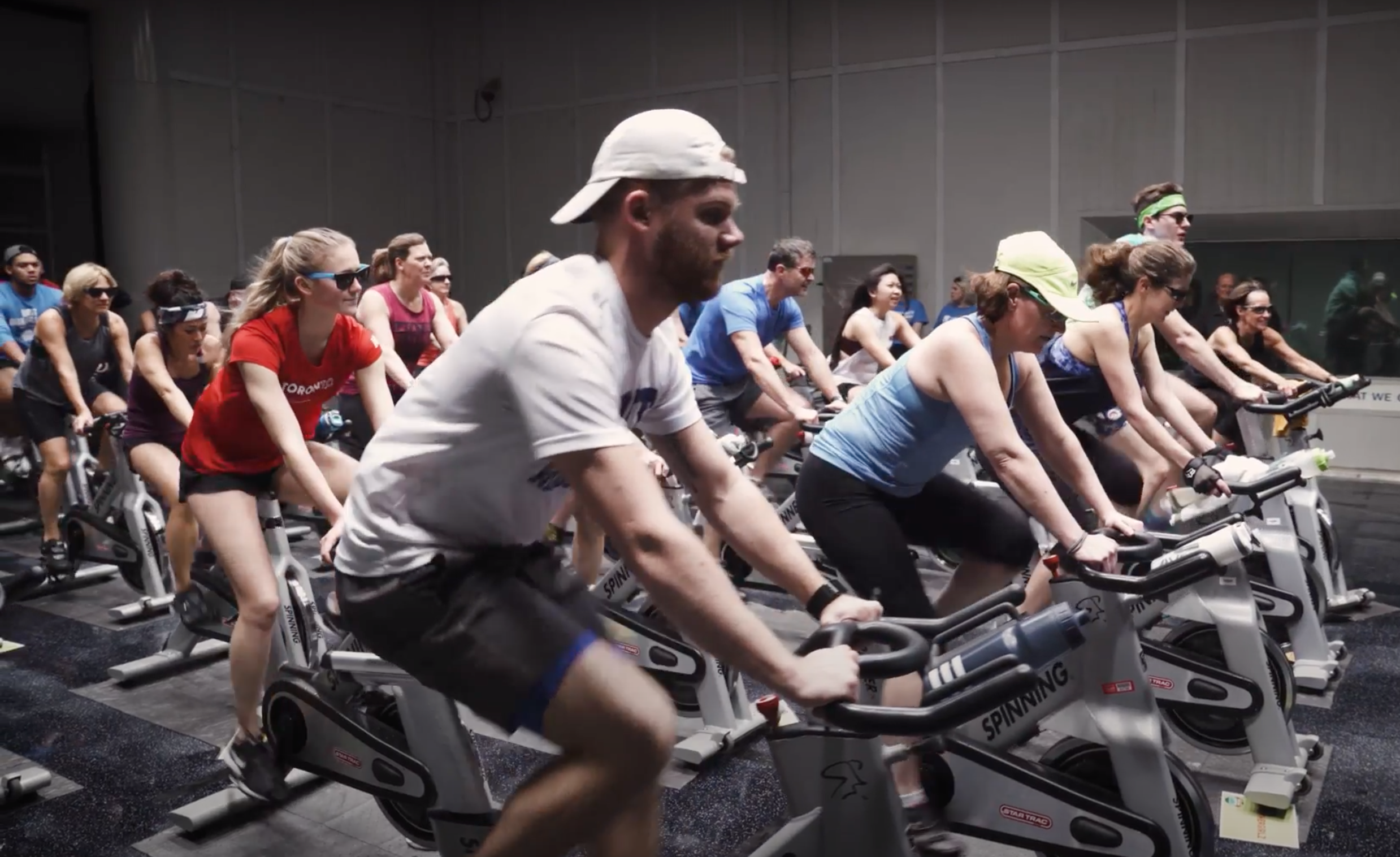 Individuals are cycling on stationary bicycles in the climatic wind tunnel. 