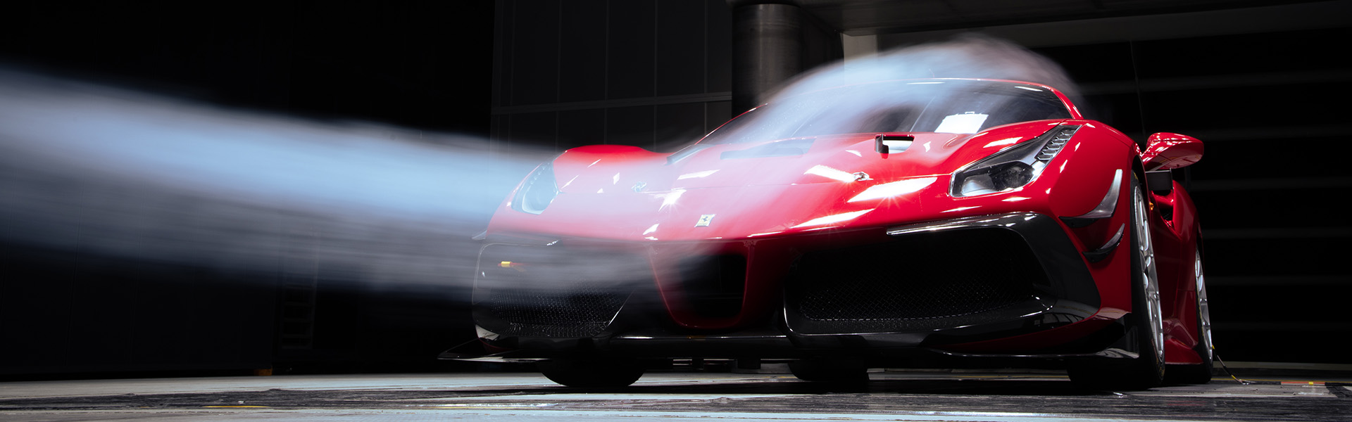 Red Ferrari in Climatic Aerodynamic Wind Tunnel with Smoke Gun
