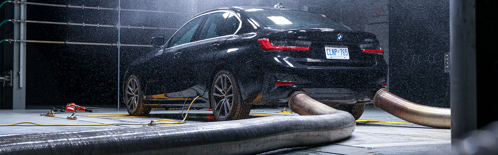Exhaust Extraction System displayed using BMW in rainy Climatic Aerodynamic Wind Tunnel
