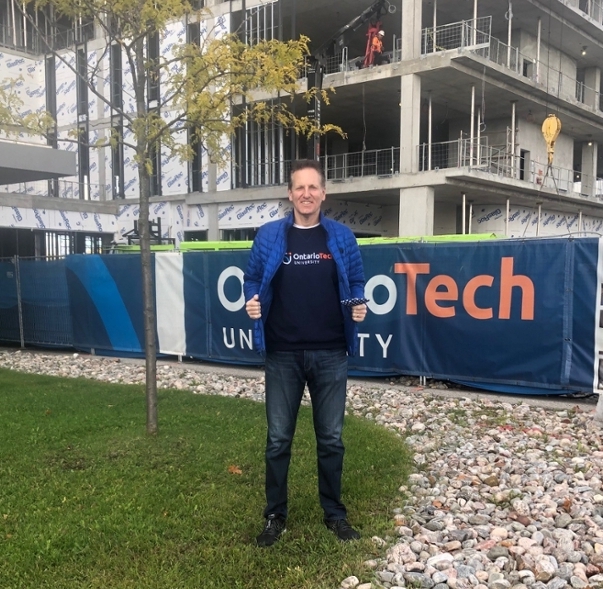 Chancellor Mitch Frazer standing outside wearing an Ontario Tech t-shirt.