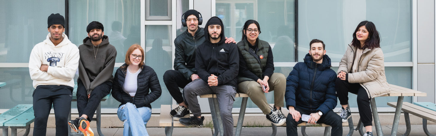 Students sitting together outside in Polonsky Commons.