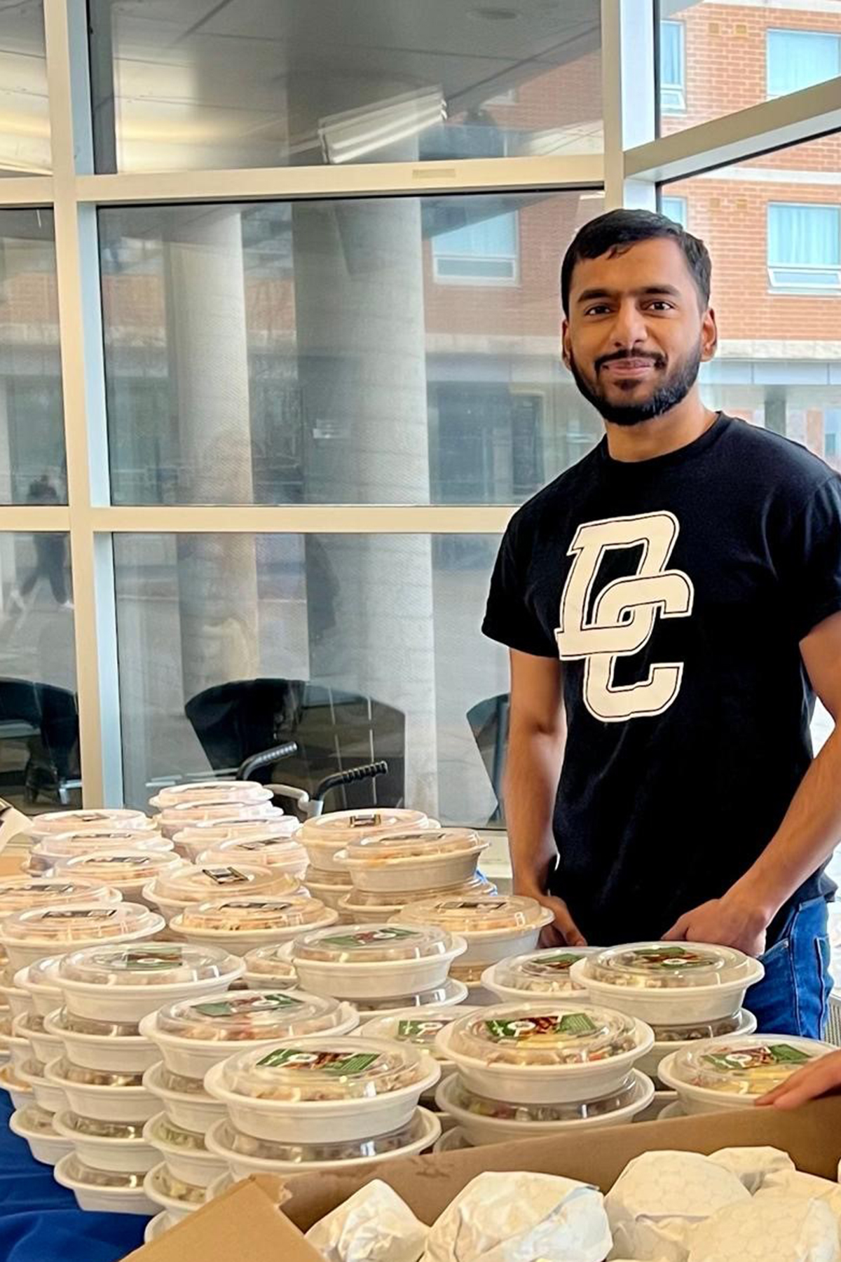 studen posing with meals