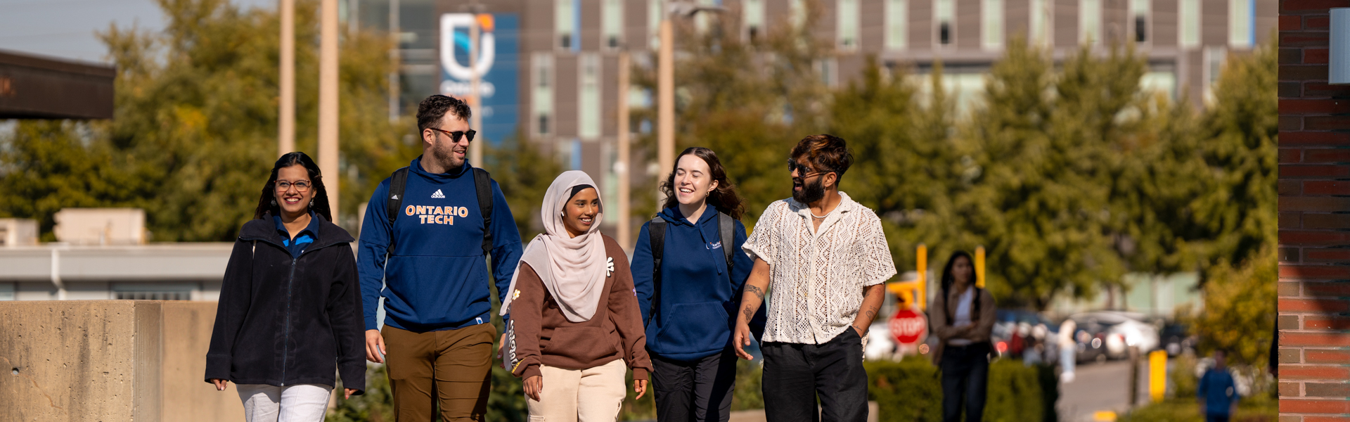 Students walking together outside at Ontario Tech's North Oshawa campus.