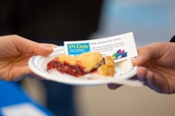 Student giving a slice of pie