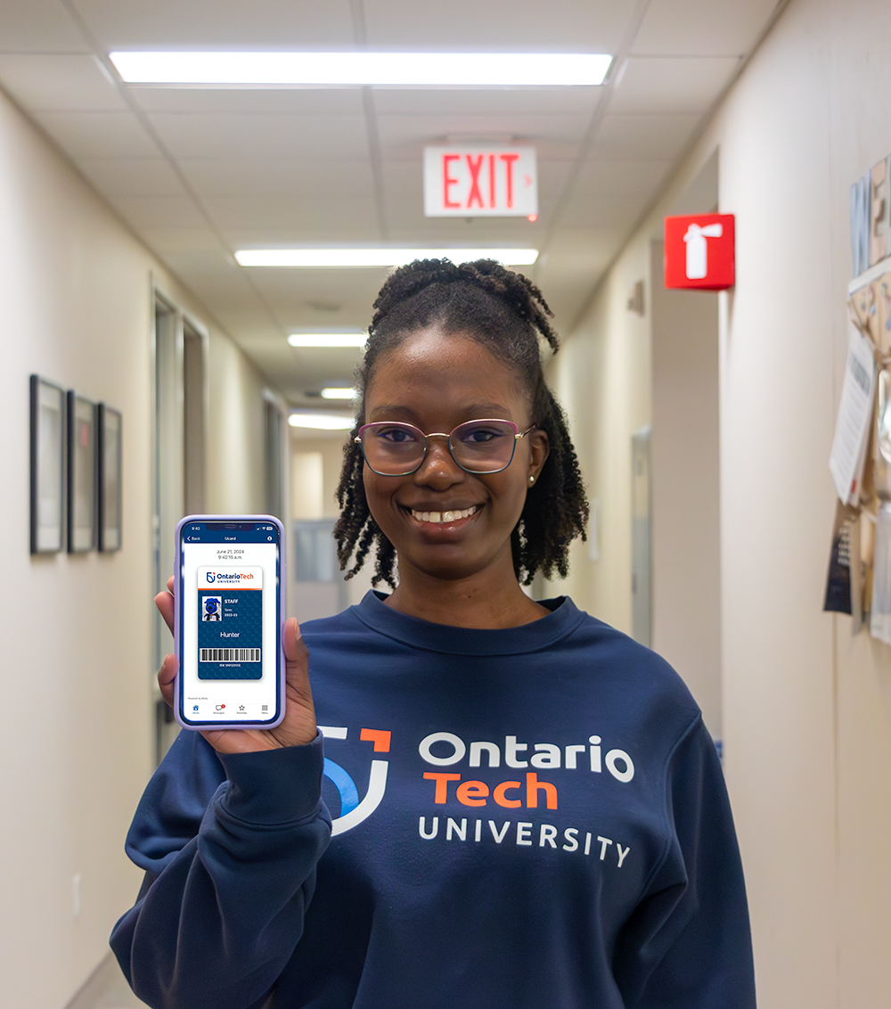 Person holding a phone showing the digital Ucard