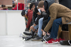 Students putting on their ice skates