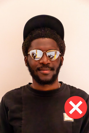 Photo of a student wearing a hat and sunglasses