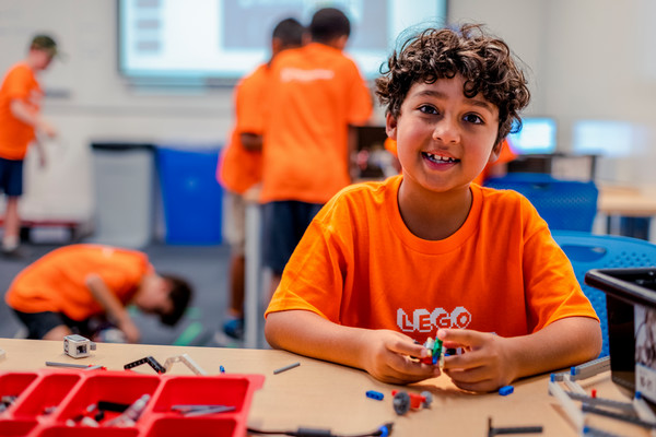 A camper using robotics at 2023 Summer Camps.