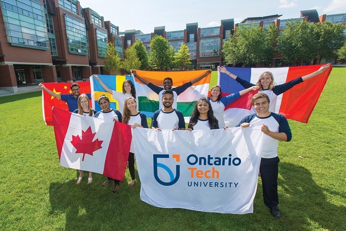 People holding 鶹ý U's and other countries' flags