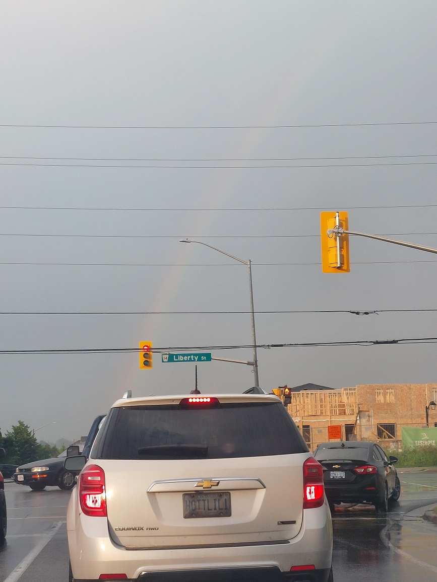 A beautiful rainbow... and a funny license plate that I noticed after! - Christine Gray