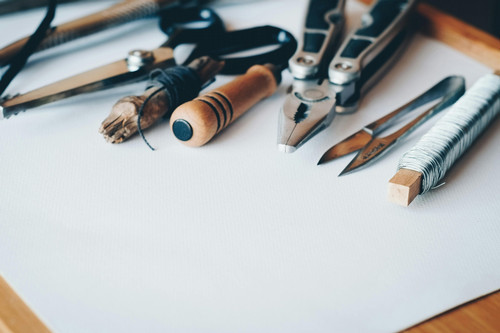 An image of various crafting tools on a table.