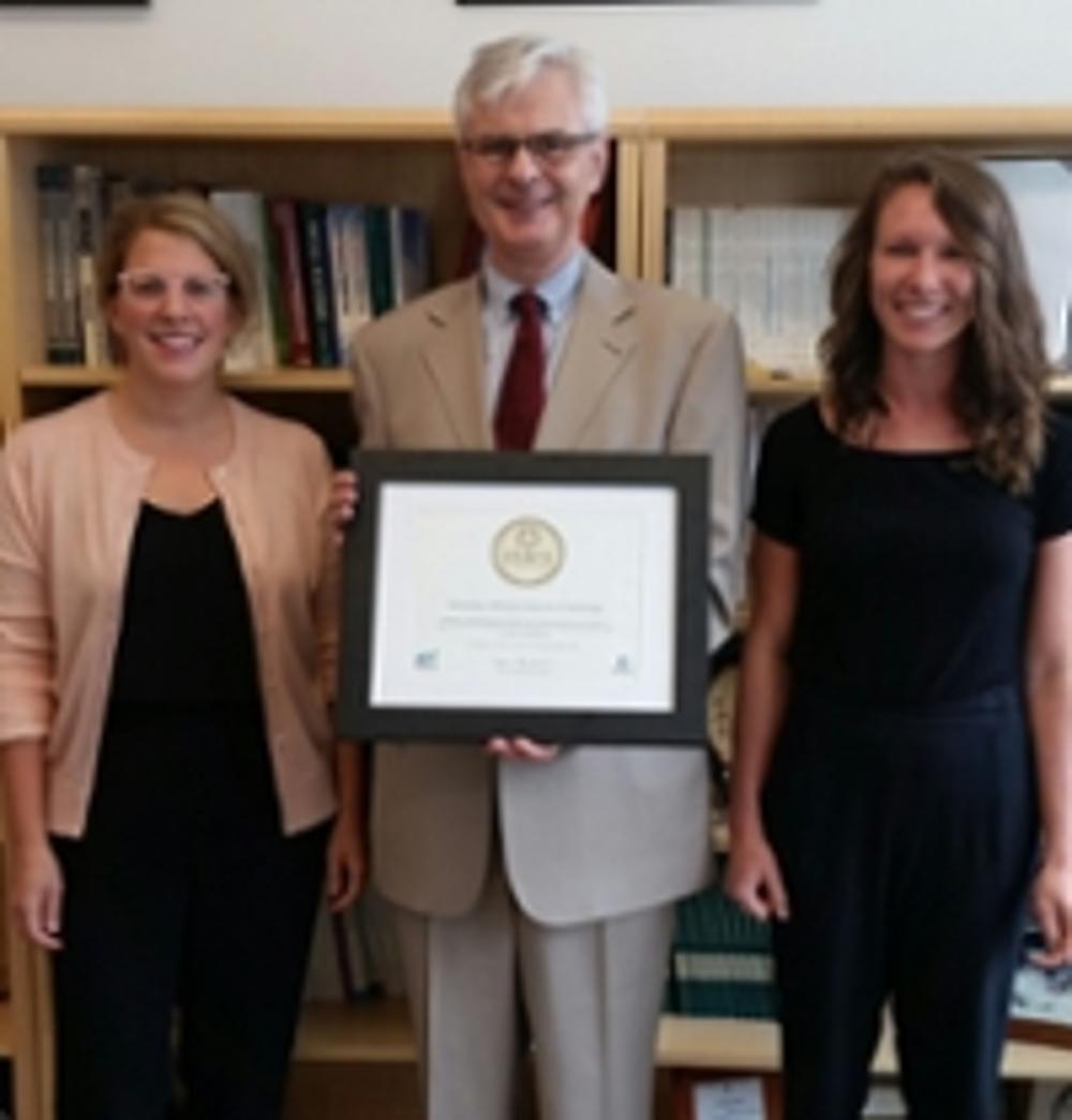 Tim, shannon and Melissa holding the STARS plaque