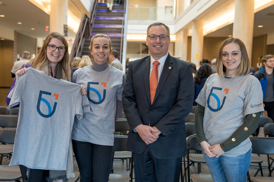 President Steven Murphy with campus community members at the 鶹ý University brand launch event.