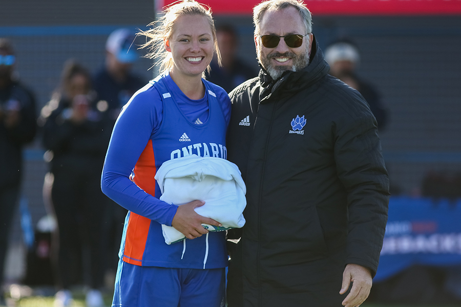 President Steven Murphy with 鶹ý Ridgebacks women's lacrosse team member Nicole Martindale.