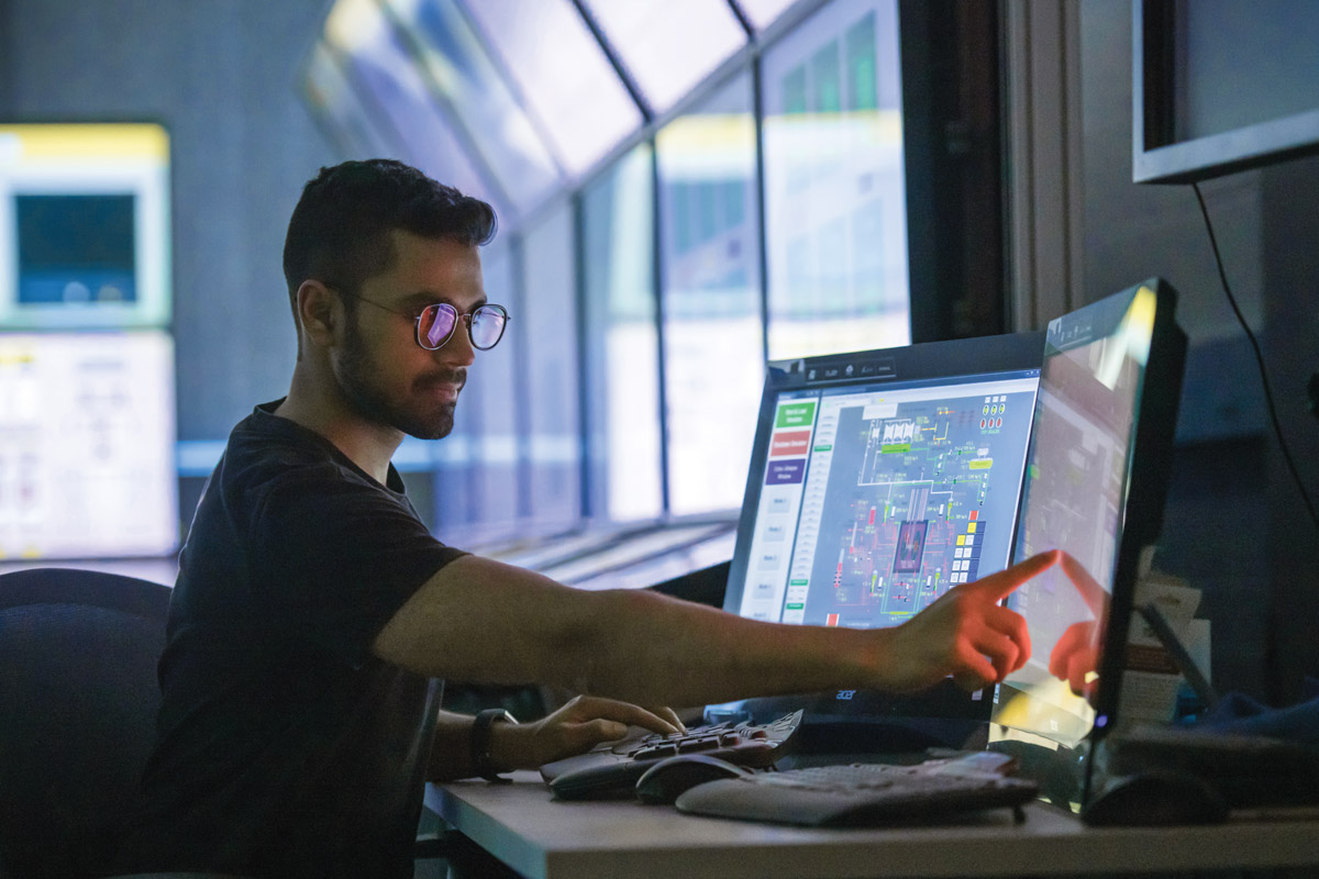 A student works in a nuclear simulation laboratory.