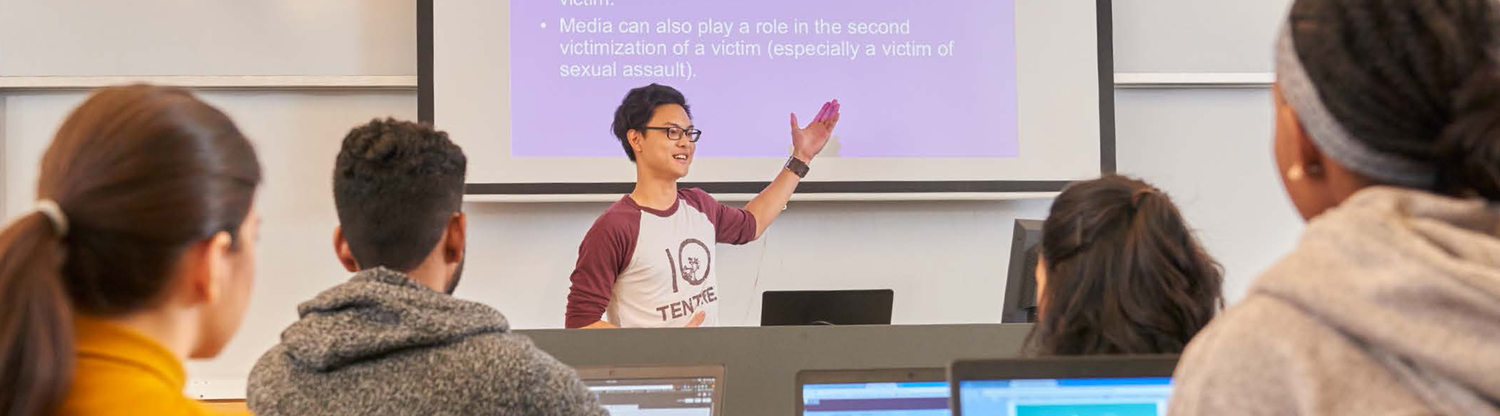 A student being assisted by an instructor in the classroom