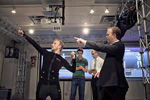 group in lab with motion suit