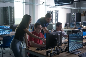 Students working around computer