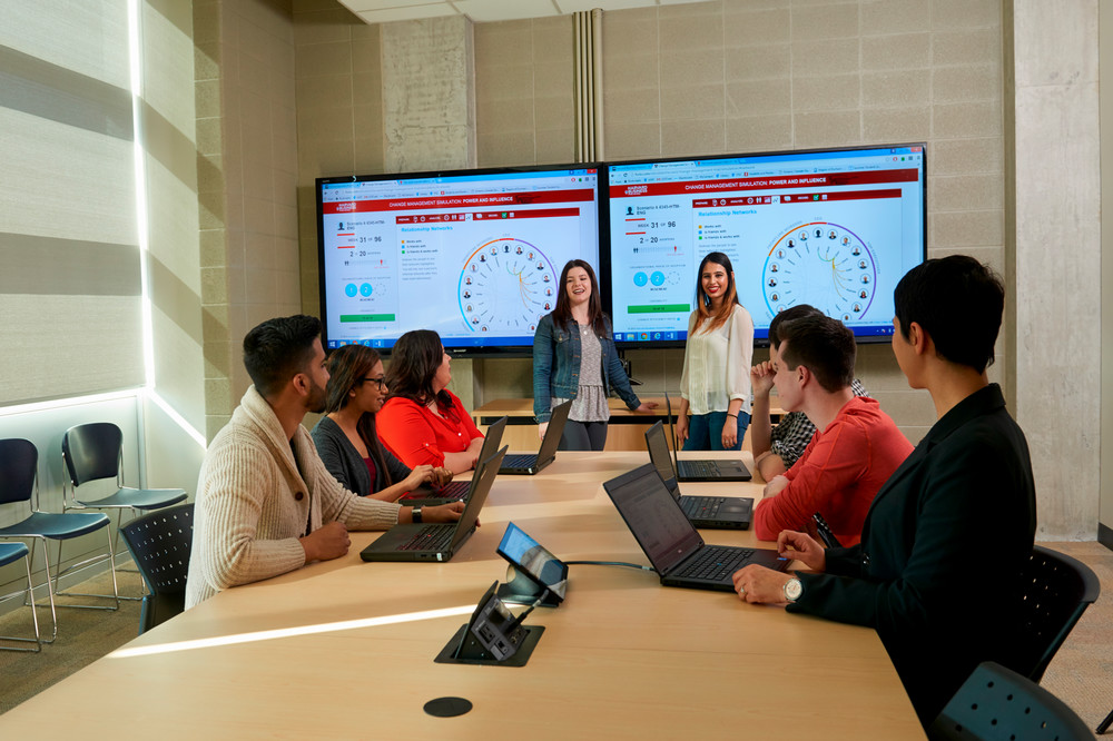 students giving a presentation in front of a class
