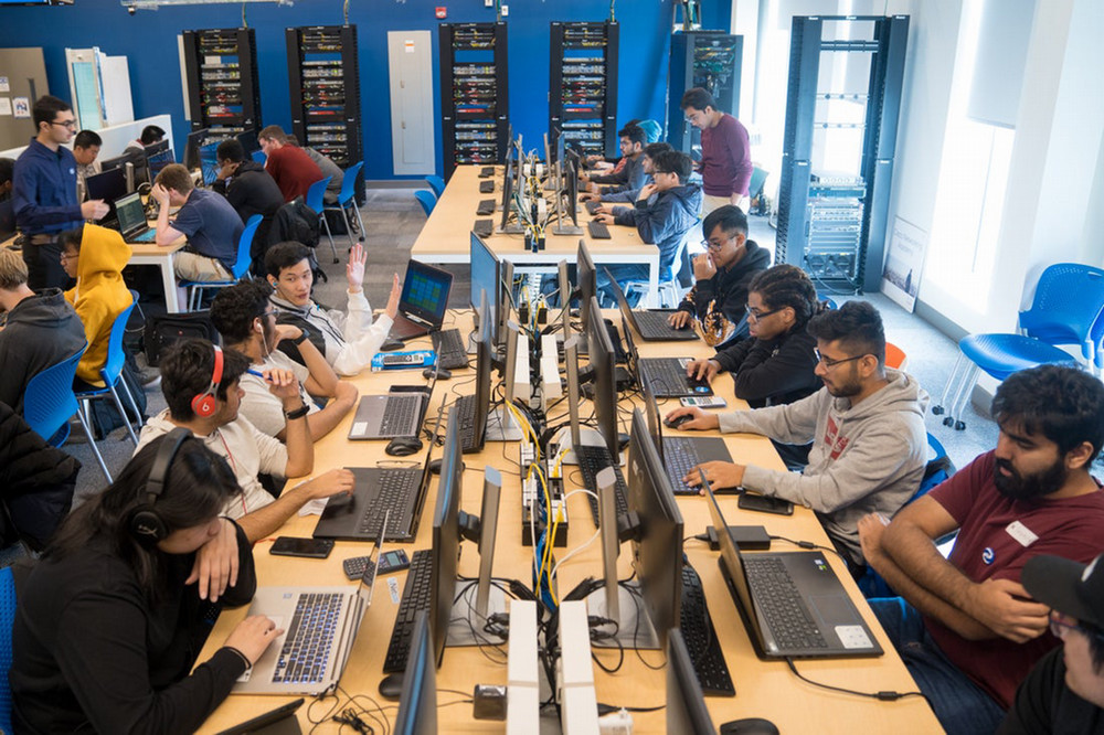 students in busy computer lab. 