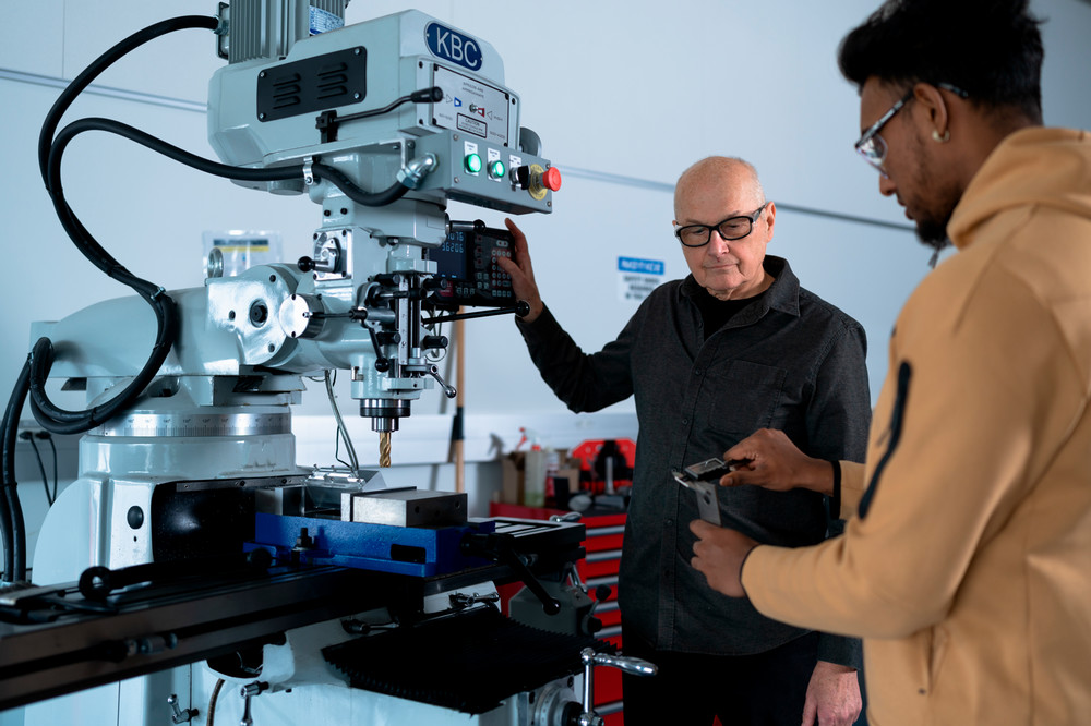 Student and professor in teaching lab. 