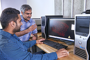 Professor and student examining data