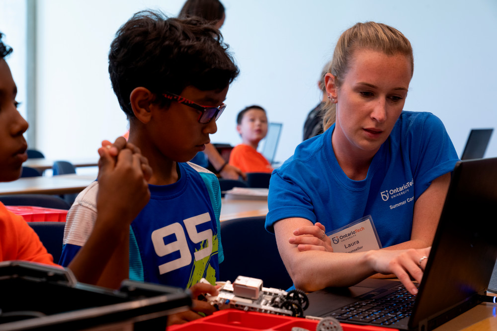 student and teacher working together