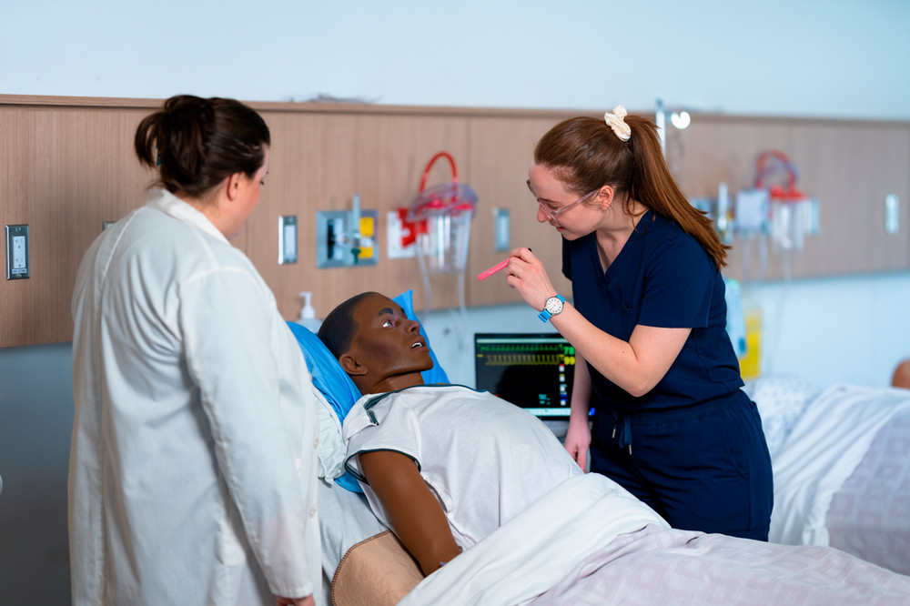 Nursing students in simulation nursing lab. 