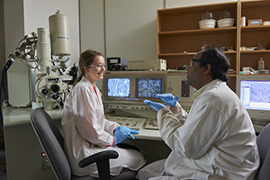 Student with prof in lab