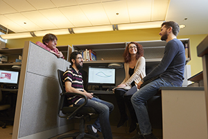 Students working around computer