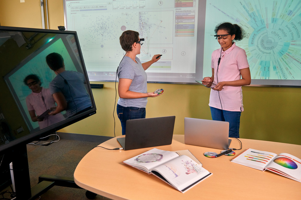 two students studying and collecting data on the brain