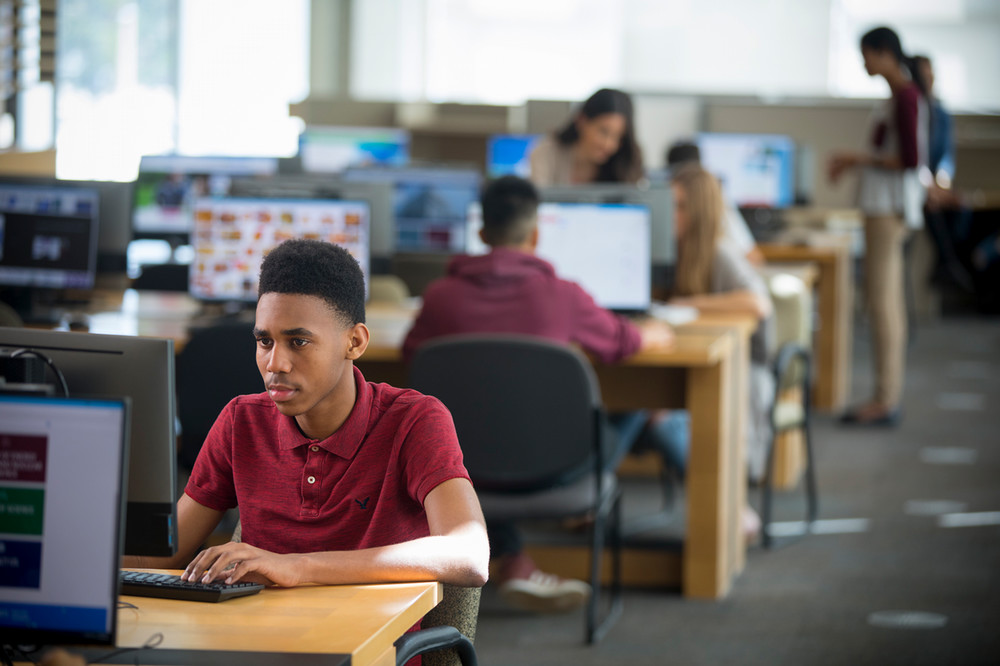 Student on computer in library
