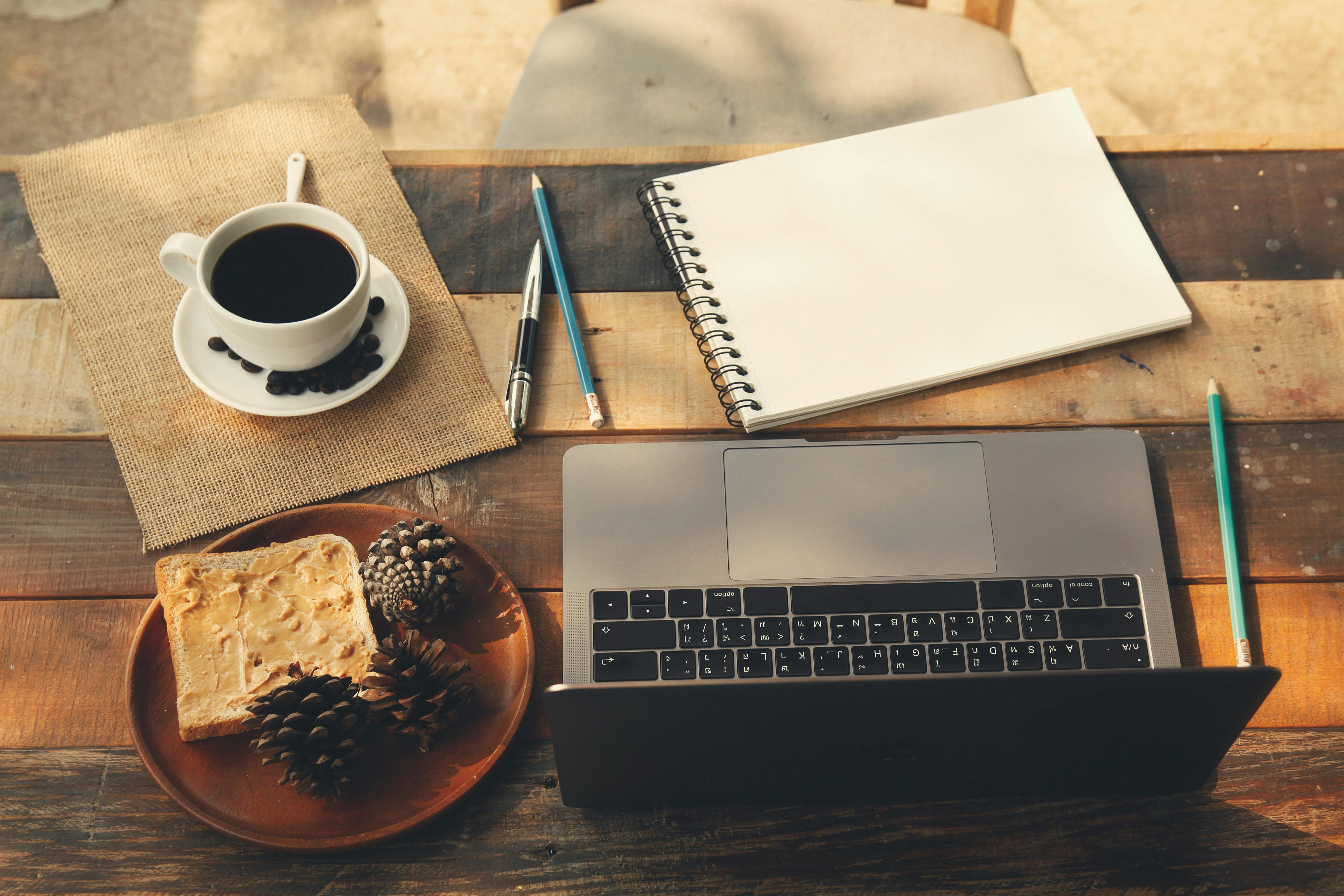 picture of coffee, books, and laptop