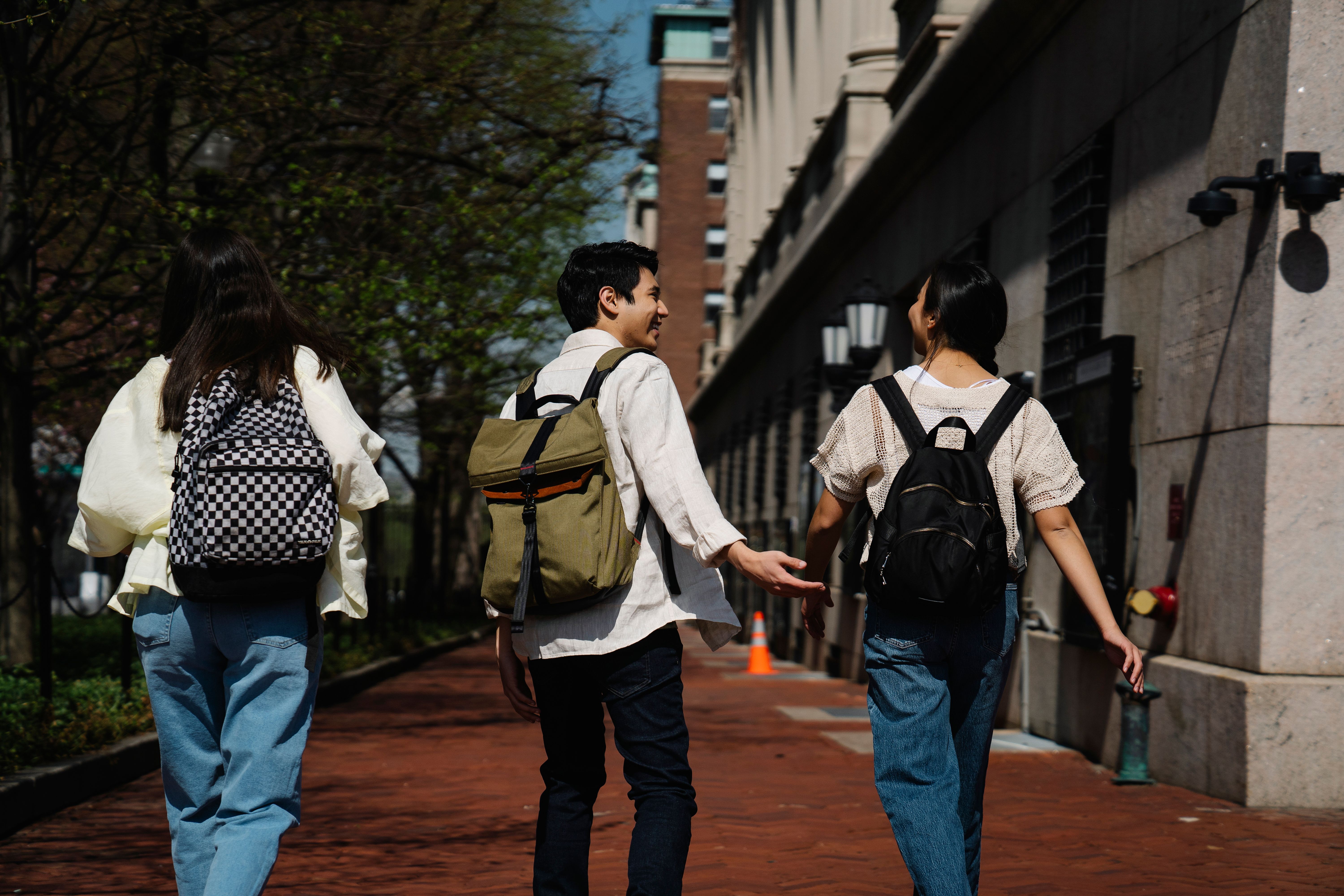 Students walking down a sidewalk together. Blog thumbnail for "Dear first-year students" 