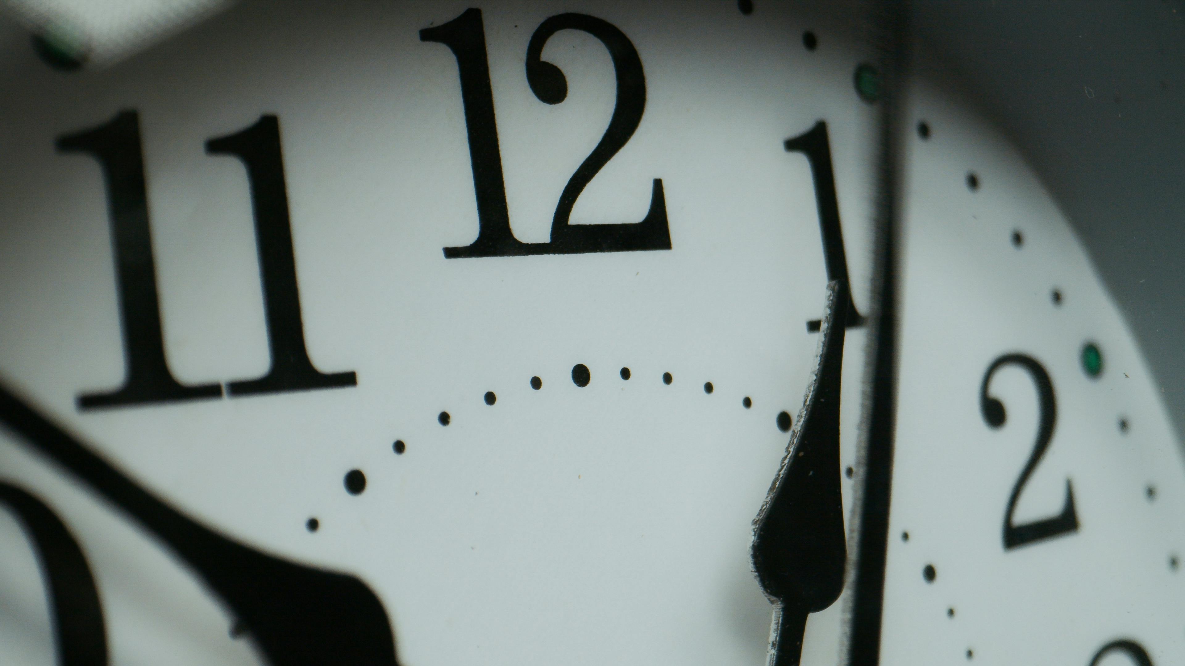 a close-up of a clock turning 