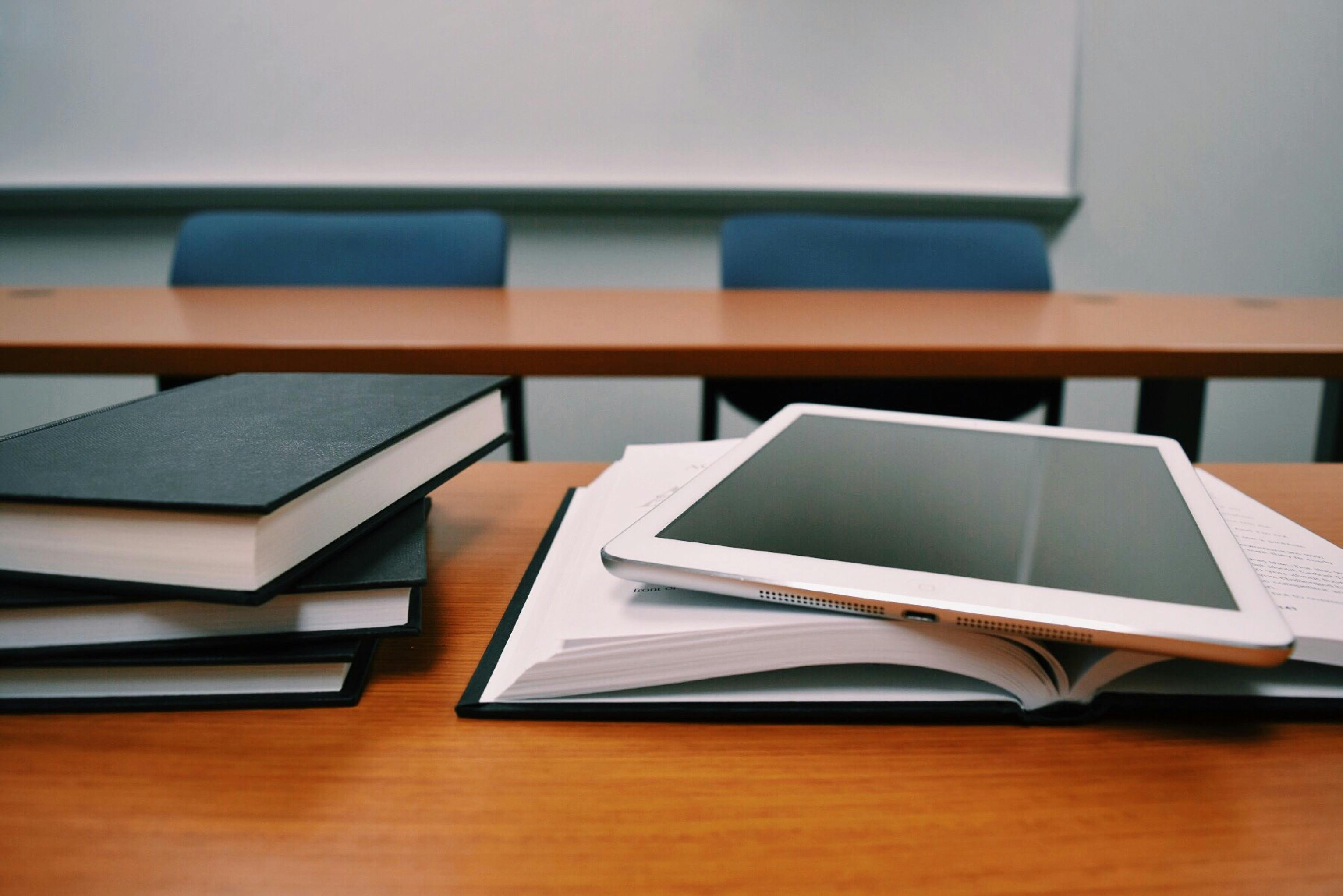 books staked on a table 