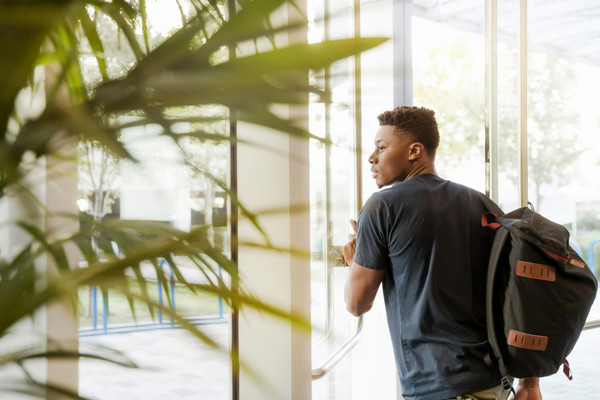 looking_out_window_with_backpack.jpg