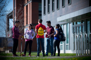 Group of students talking outside ERC building