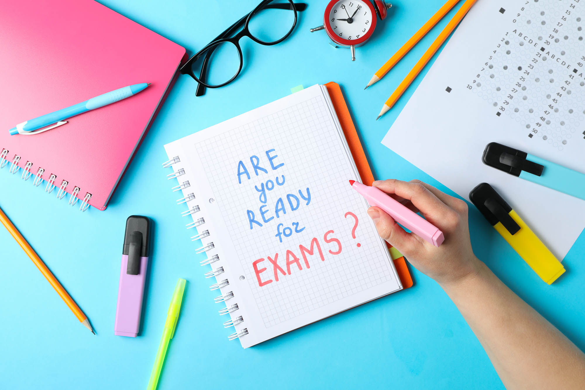 card reading 'are you ready for exams' amid study supplies