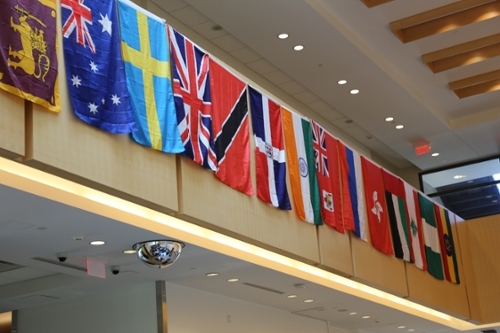 flags from different countries hanging in atrium