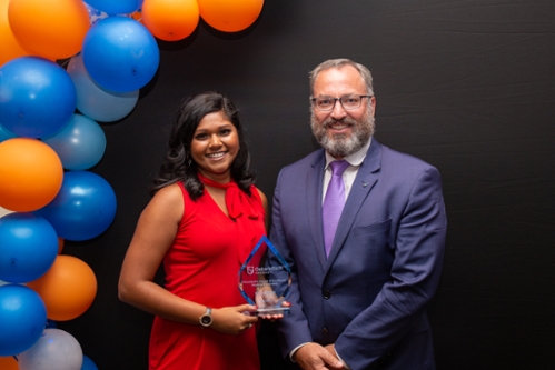 Past award recipient Keisha Douraj standing with President Steven Murphy.