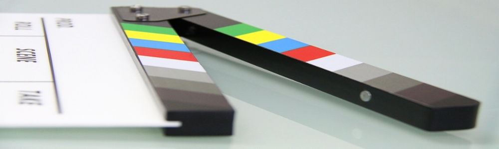 A close up of the colourful bars on the clapperboard