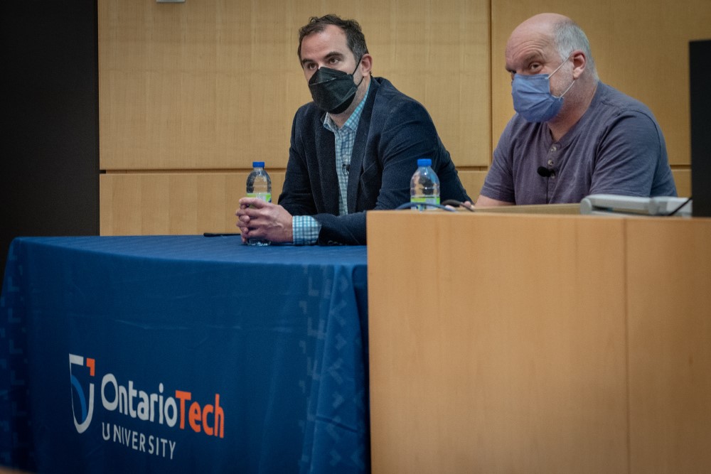 Dr. Jeremy Bradbury (FSc, left) and Dr. Stephen Marsh (FBIT, right) participate in a panel discussion.