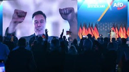 Elon Musk appearing remotely at the AfD’s party conference 