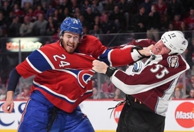 Two hockey players fist fighting