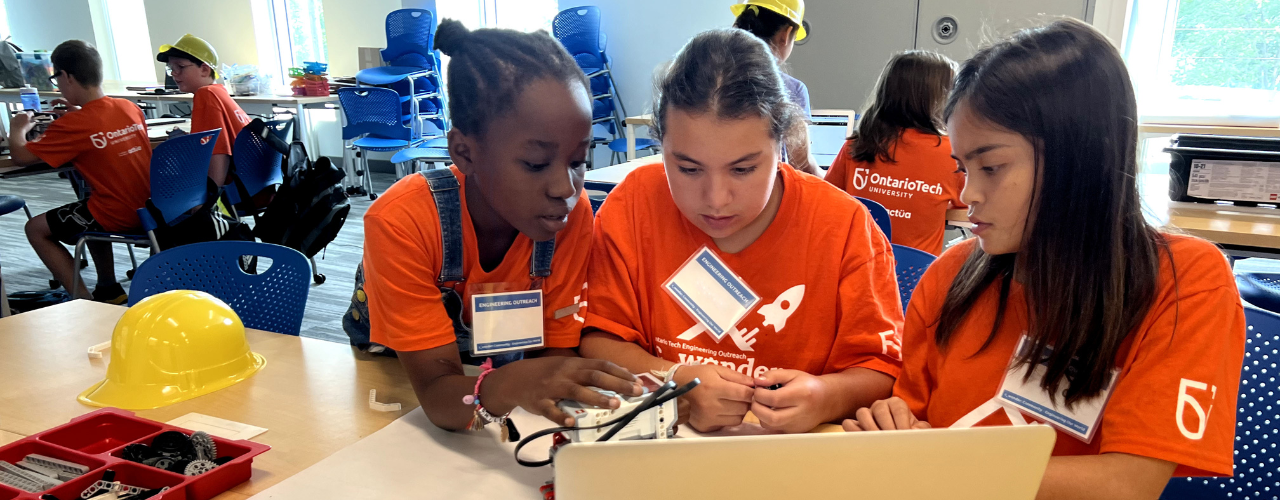 A photo of 3 girls using computers