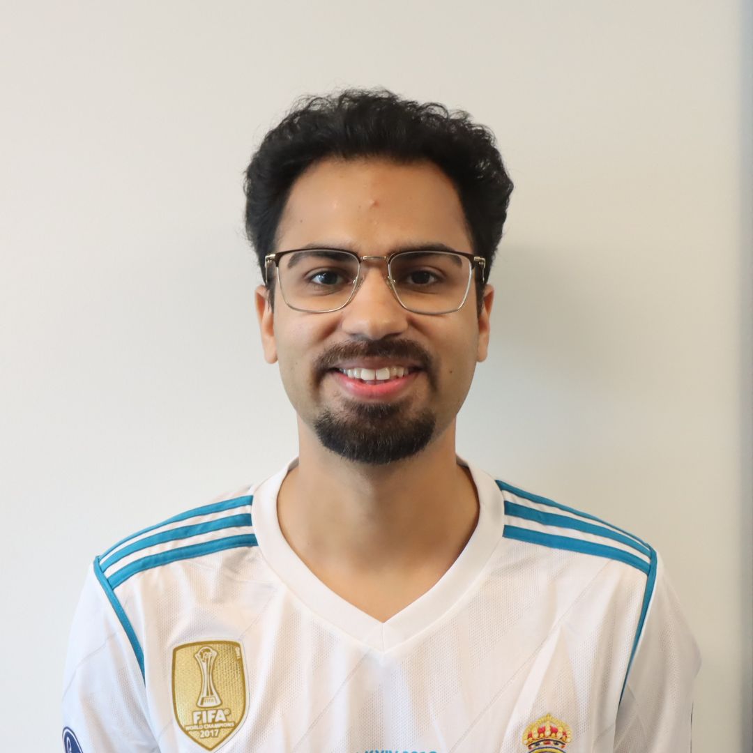 Portrait of a smiling man wearing a FIFA jersey